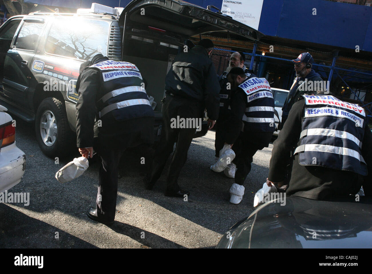 EMS taking the body of a smoke inhalation victim of Harvey Kurdish