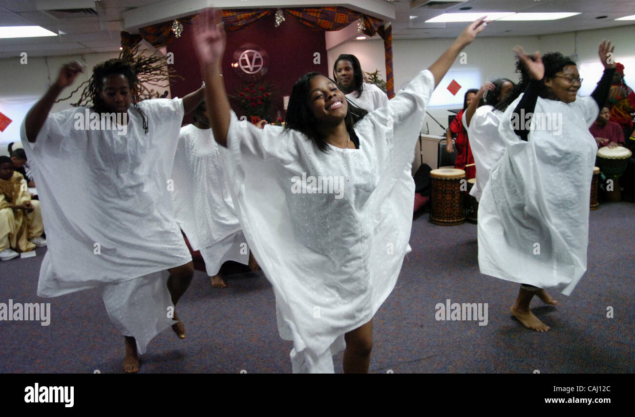 LEDE PHOTO --  Dalila Morton, 22, of Sacramento, center, dances a 'Lamba' dance with dancers from Umoja Productions, to celebrate Nia, or 'purpose' during a Kwanzaa celebration,  Sunday, December 30, 2007, at the Center for Spiritual Awareness in West Sacramento. Lezlie Sterling Stock Photo