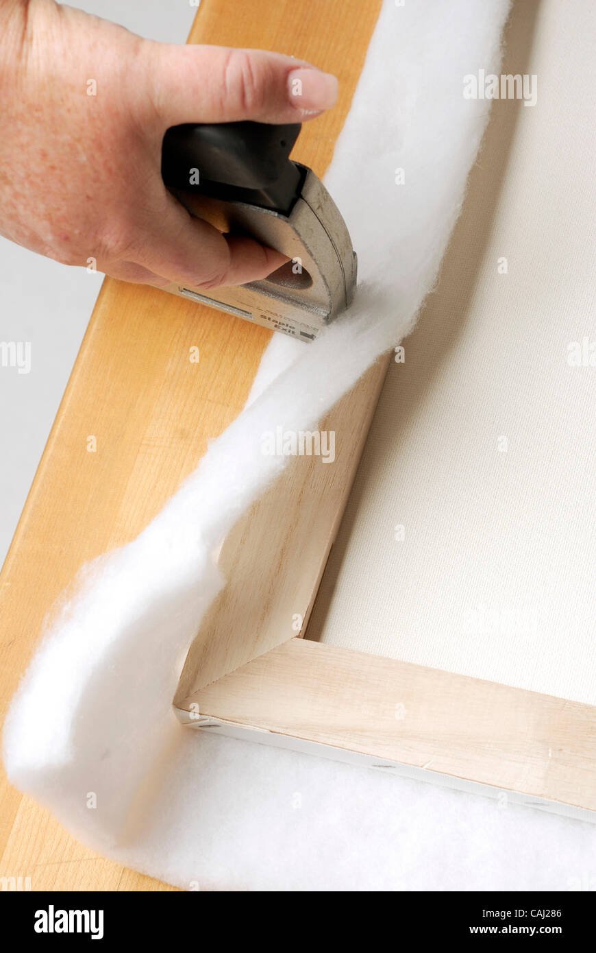 Step 1 Staple the batting around the canvas frame. How to make a