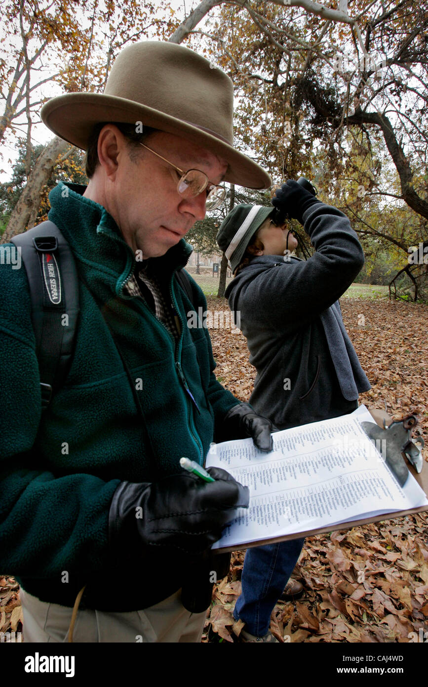 December 29, 2007, Escondido, California, USA At Kit Carson Park Audubon Society member JIM RUSSELL enters information on a tally sheet and clipboard, keeping track of the various species of birds he and fellow Society members have spotted during the Society's annual bird count. At right using binoc Stock Photo