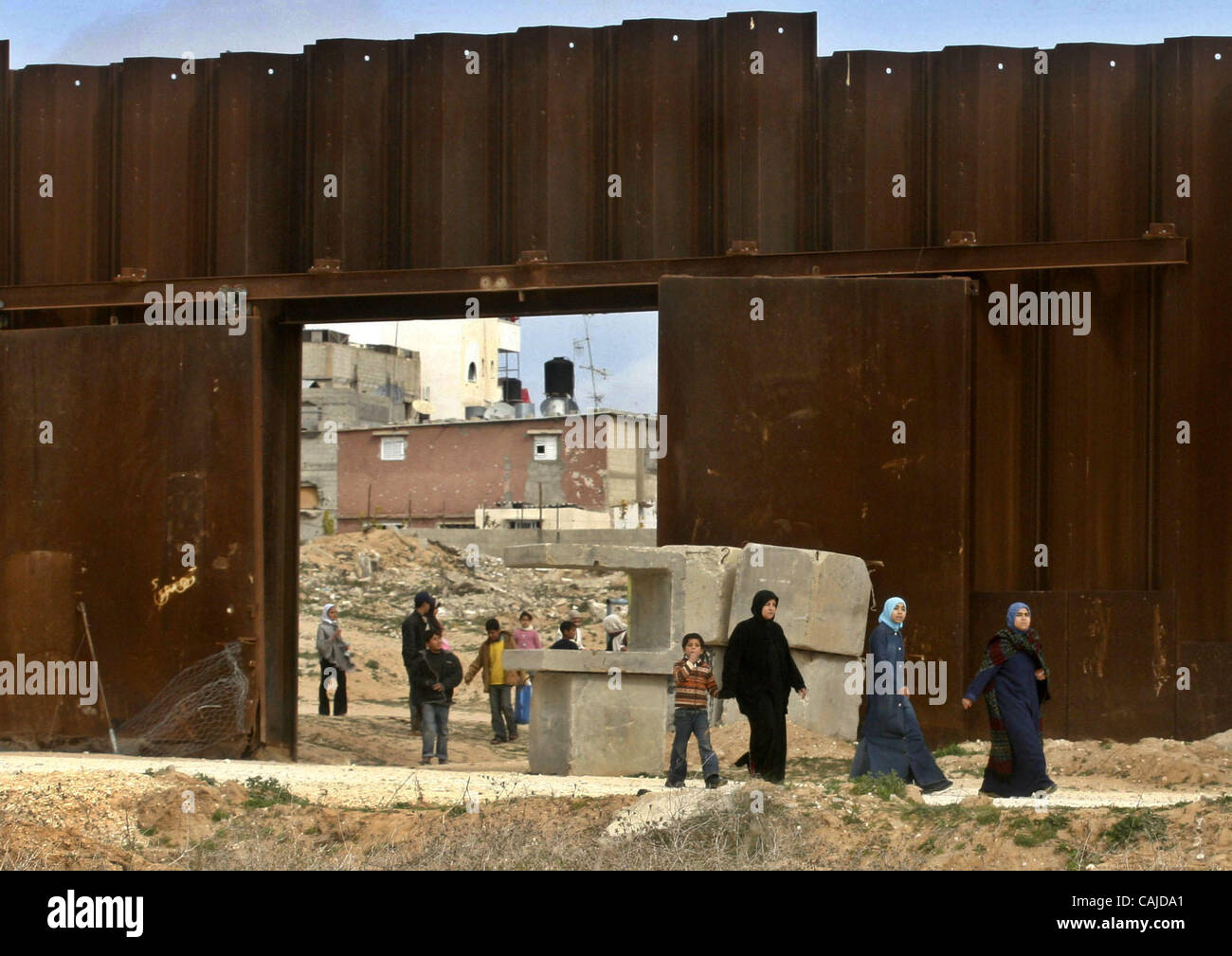 Tens of thousands more Palestinians flooded across the breached border ...
