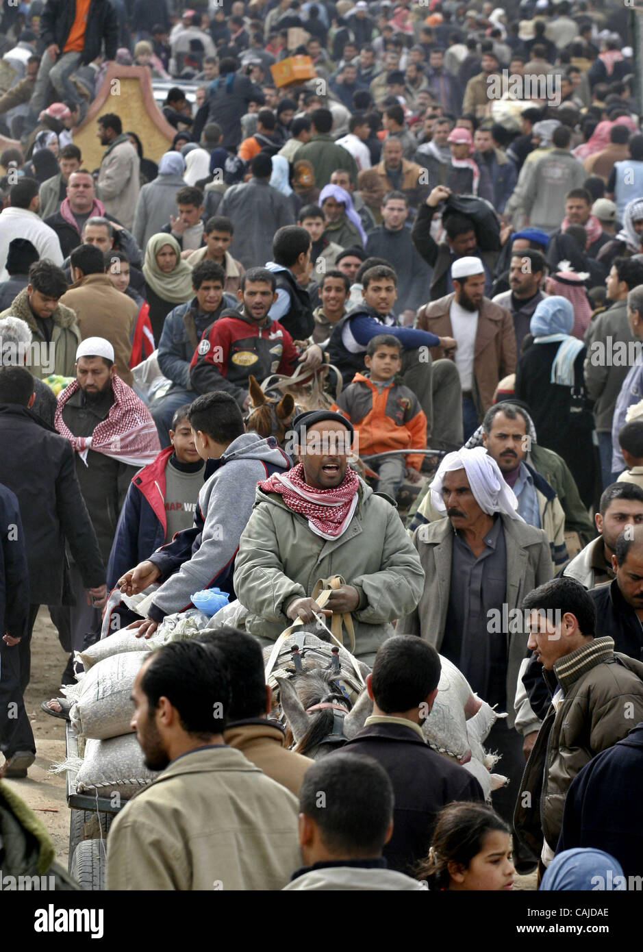 Tens of thousands more Palestinians flooded across the breached border ...
