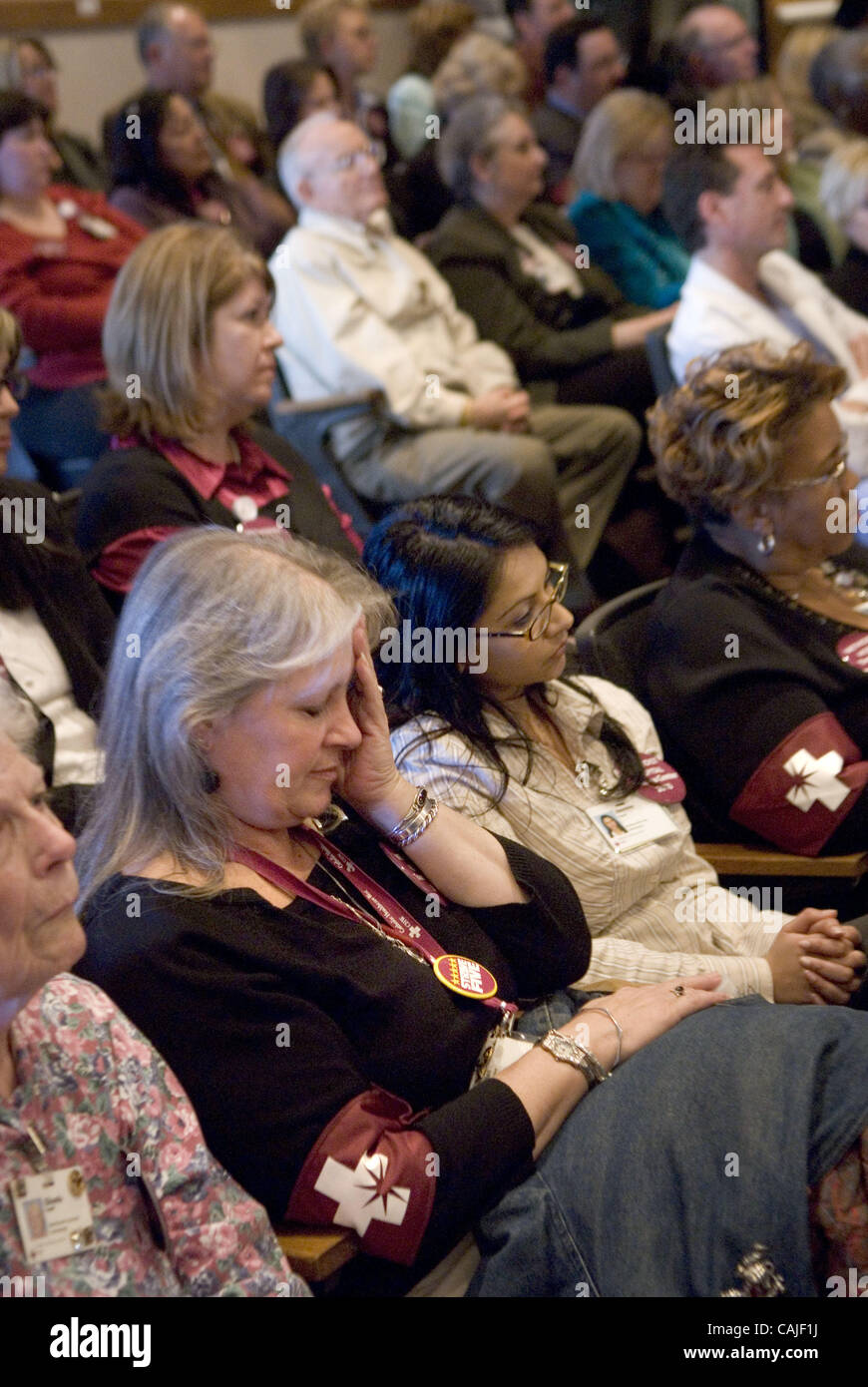 From left, supporters of Methodist, Ellen Nassimbene, Jasmine Prasad and Lonnie Anderson, all employees of the Bruceville Terrace Skilled Nursing Facility, listen to speakers at the board chambers at the Sacramento County Administrative Building December 11, 2007.  Today the decision will be announc Stock Photo