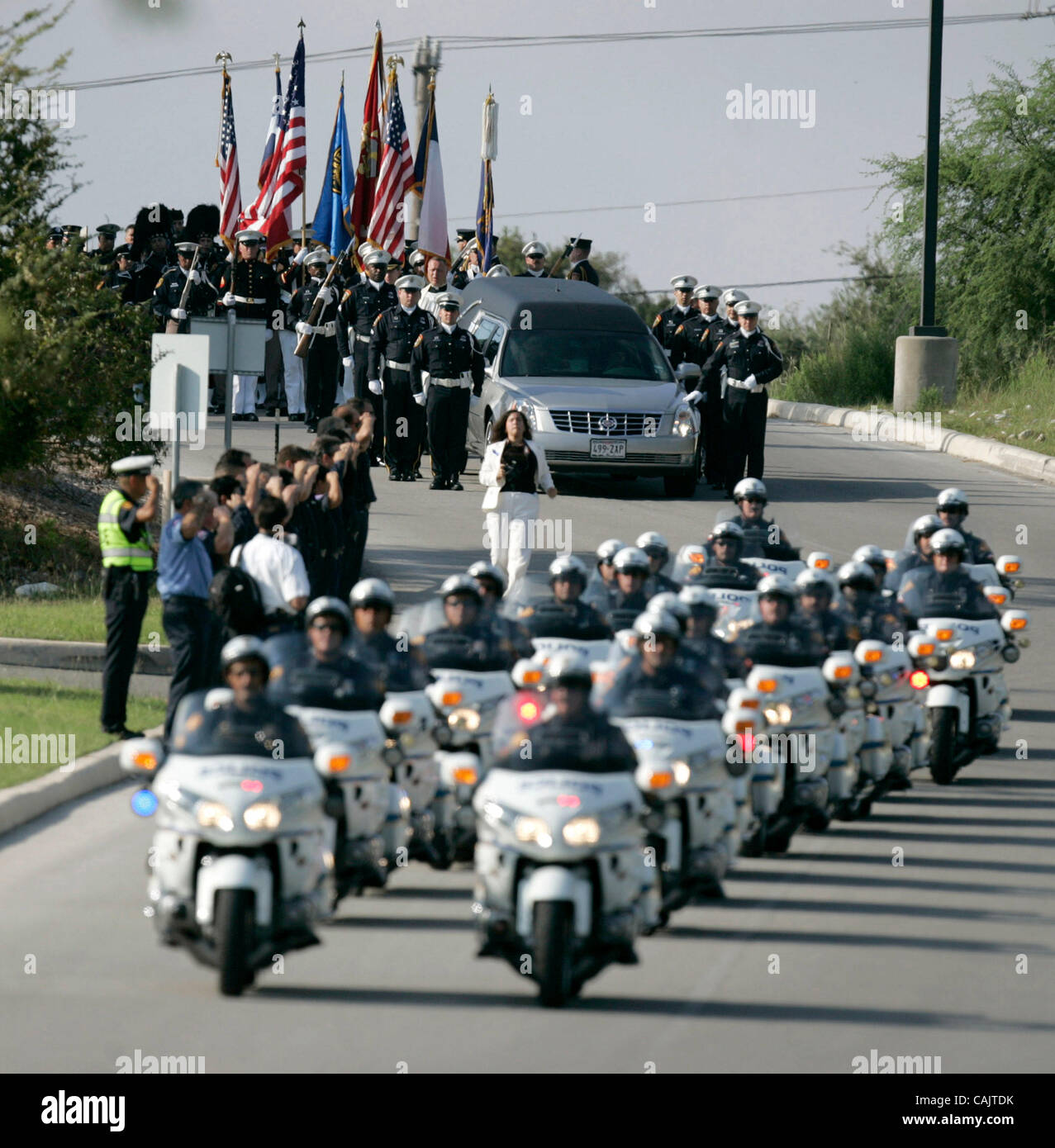 METRO    -----   The procession carrying the body of slain San Antonio police Det. Mario Moreno makes its way Thursday morning Sept. 27, 2007 to Community Bible Church in San Antonio for the start of officer Moreno's funeral service. Moreno was killed Sept. 21, 2007 while trying to apprehend a suspe Stock Photo