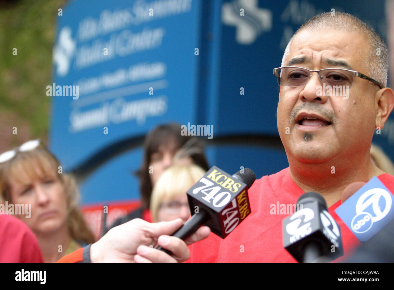 Efren Garza , a nurse from Alta Bates Adolesence Psychiatry, is one of many that spoke at a morning press conference, Friday, Sept. 28, 2007  announcing plans for a major bay area wide nurses strike in October.  Nurses from many different bay area Medical centers stood outside Summit Medical Center  Stock Photo
