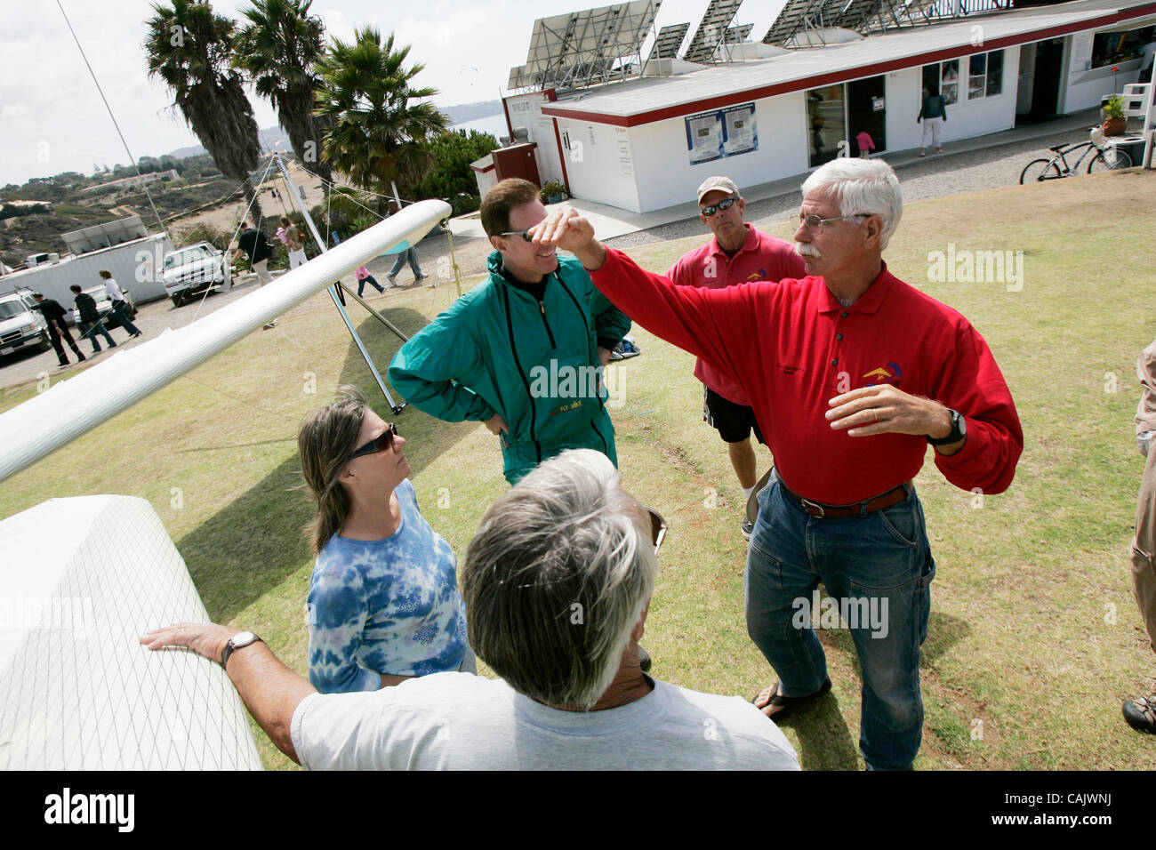 September 29th, 2007, San Diego, California, USA. DAVID JEBB (red shirt, hands up in middle), who runs the Torrey Pines Glider Port,  talks to hang glider pilots about making their approach for landing into the Torrey Pines Glider Port on Saturday in San Diego, California.  Mandatory Credit: photo b Stock Photo