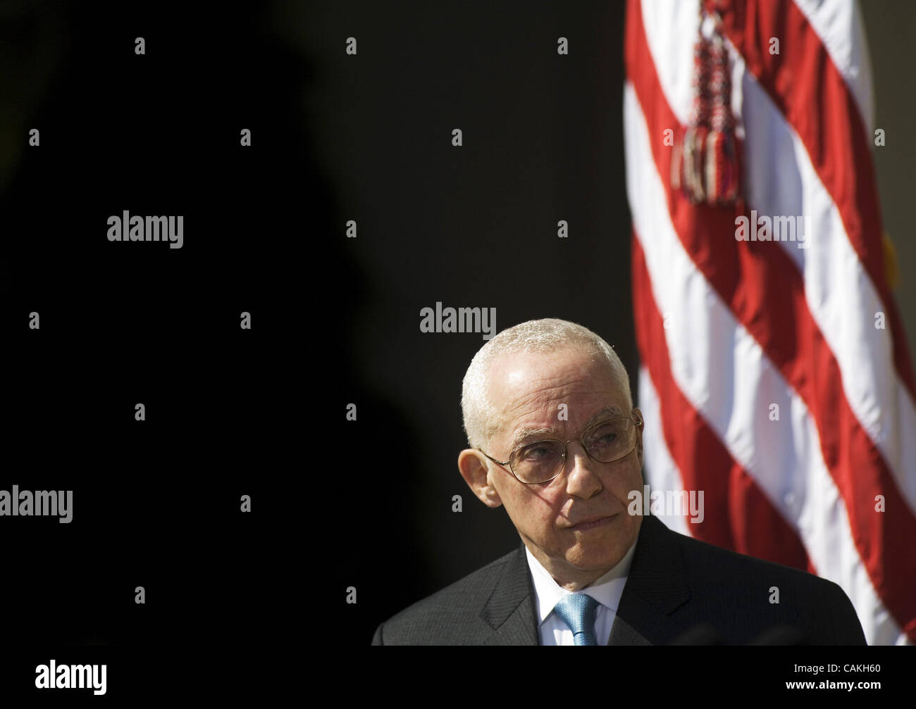 Retired federal judge Michael Mukasey looks at US President George W. Bush while he speaks 17 September 2007 during a press conference in the Rose Garden of the White House in Washington, DC. Bush named Mukasey as replacement for Attorney General Alberto Gonzales who resigned in August. AFP PHOTO/Ma Stock Photo