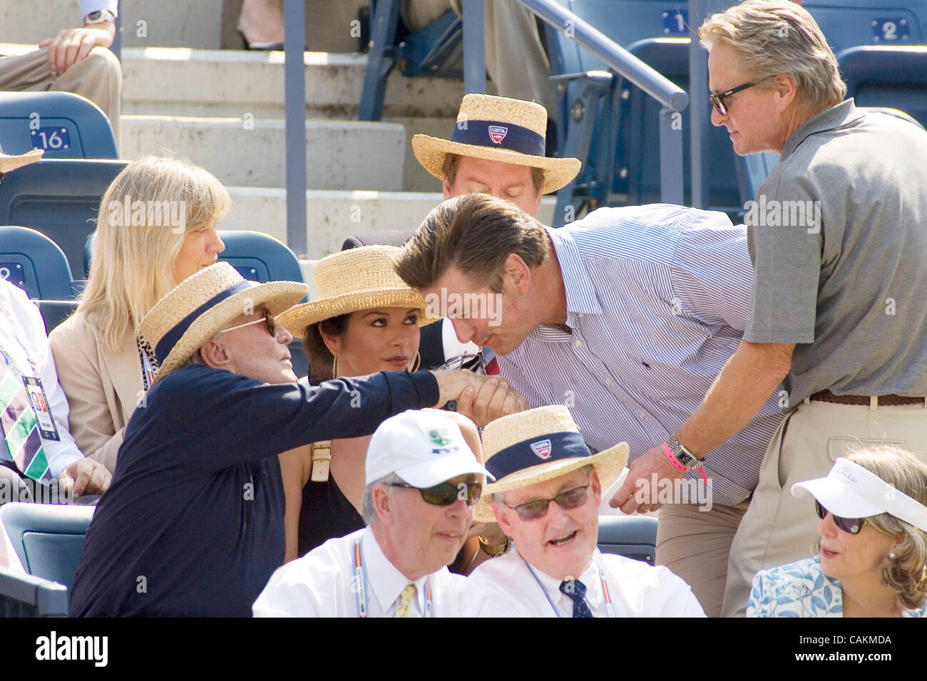 Alec Baldwin kisses Kirk Douglas hand as Catherine Zeta Jones & Michael