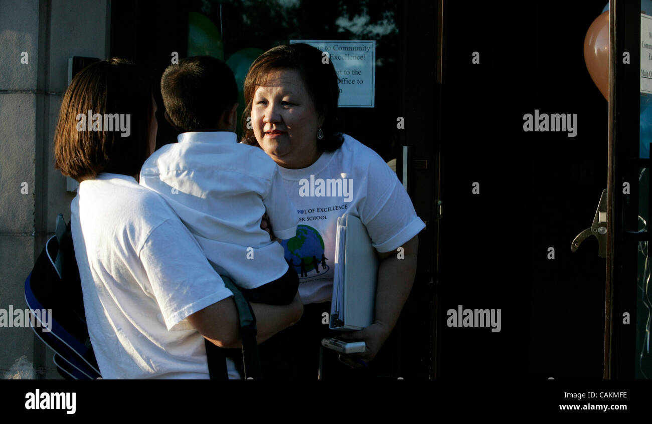 Sep 13, 2007 - Minneapolis, MN, USA - Principal Mo Chang consoled Chi Meng Lee who is being held by kindergarten teacher Heather Rietz on the first day at Community School of Excellence.  (Credit Image: © Minneapolis Star Tribune/ZUMA Press) Stock Photo