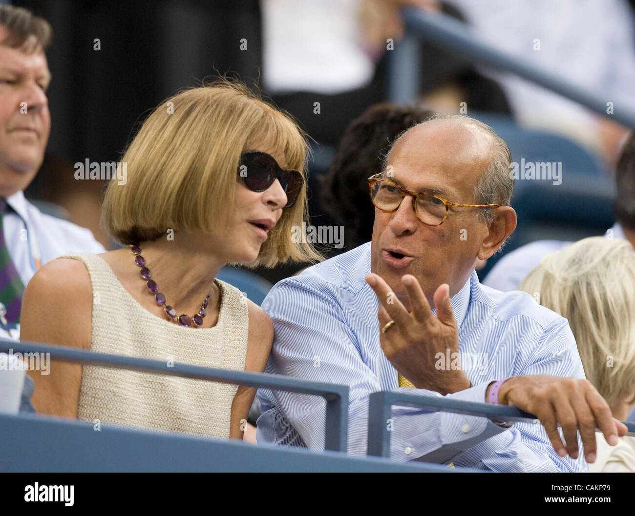 Anna Wintour talks to Oscar De La Renta as  Roger Federer defeats Novak Djokovic for his fourth straight title  at the 2007 US Open Tennis Championships men's final.  Dustin Hoffman and Chevy Chase are also seated in the President's Box. Stock Photo