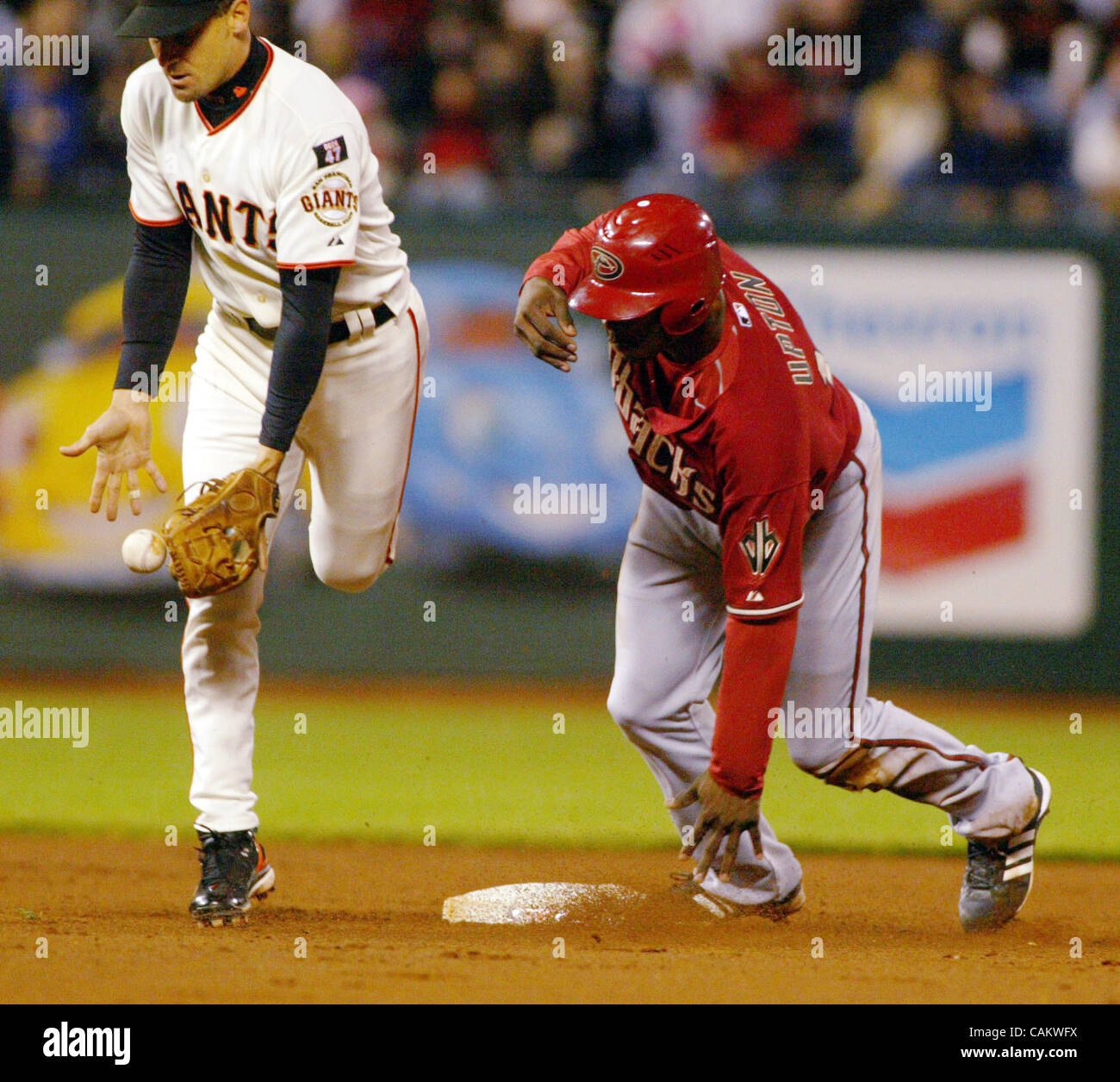 Giants' shortstop Omar Vizquel stops a bad throw to second as the ...