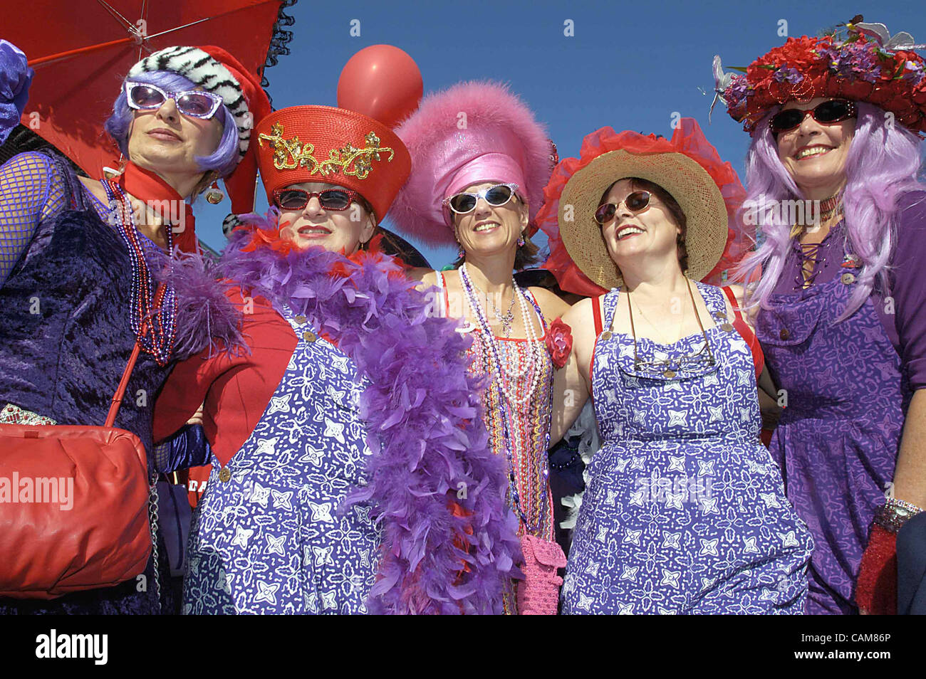 Nov. 23, 2003 - Pasadena, California, USA - Members of The Red Hat Society are resplendent in their de rigeur colors, red and purple, as they prepare to march in the 2003 Dooh Dah Parade, the irreverent and quirky takeoff on Pasadena's famed Rose Parade. (Credit Image: Â© Brian Cahn/ZUMAPRESS.com) Stock Photo