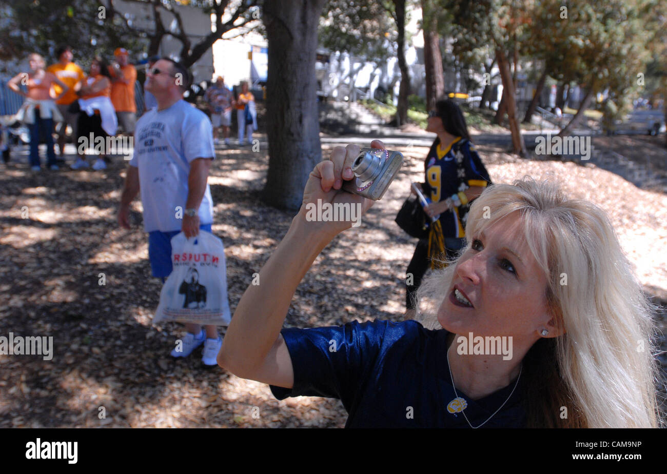 Cal fan Janice Ridondo, from Las Vegas, takes a photo of tree sitters