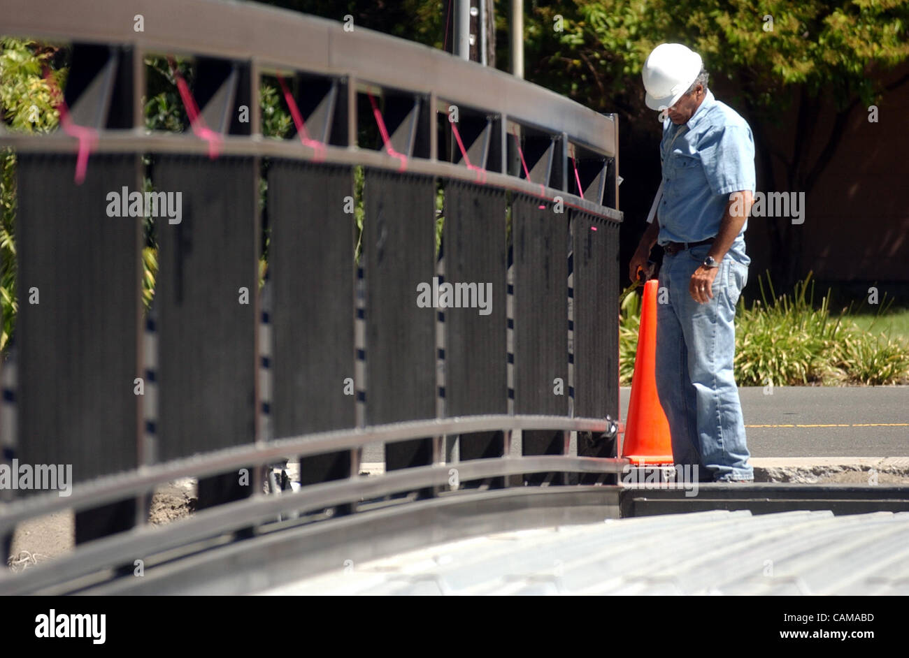 Project Manager Paul Jahanian works on the Prune Street pedestrian bridge, Tuesday, Sept. 4, 2007, in Pinole, Calif. The 84ft. long and 10ft. wide bridge was set down earlier in the day and will be completely installed in the coming weeks.   (Joanna Jhanda/Contra Costa Times) Stock Photo