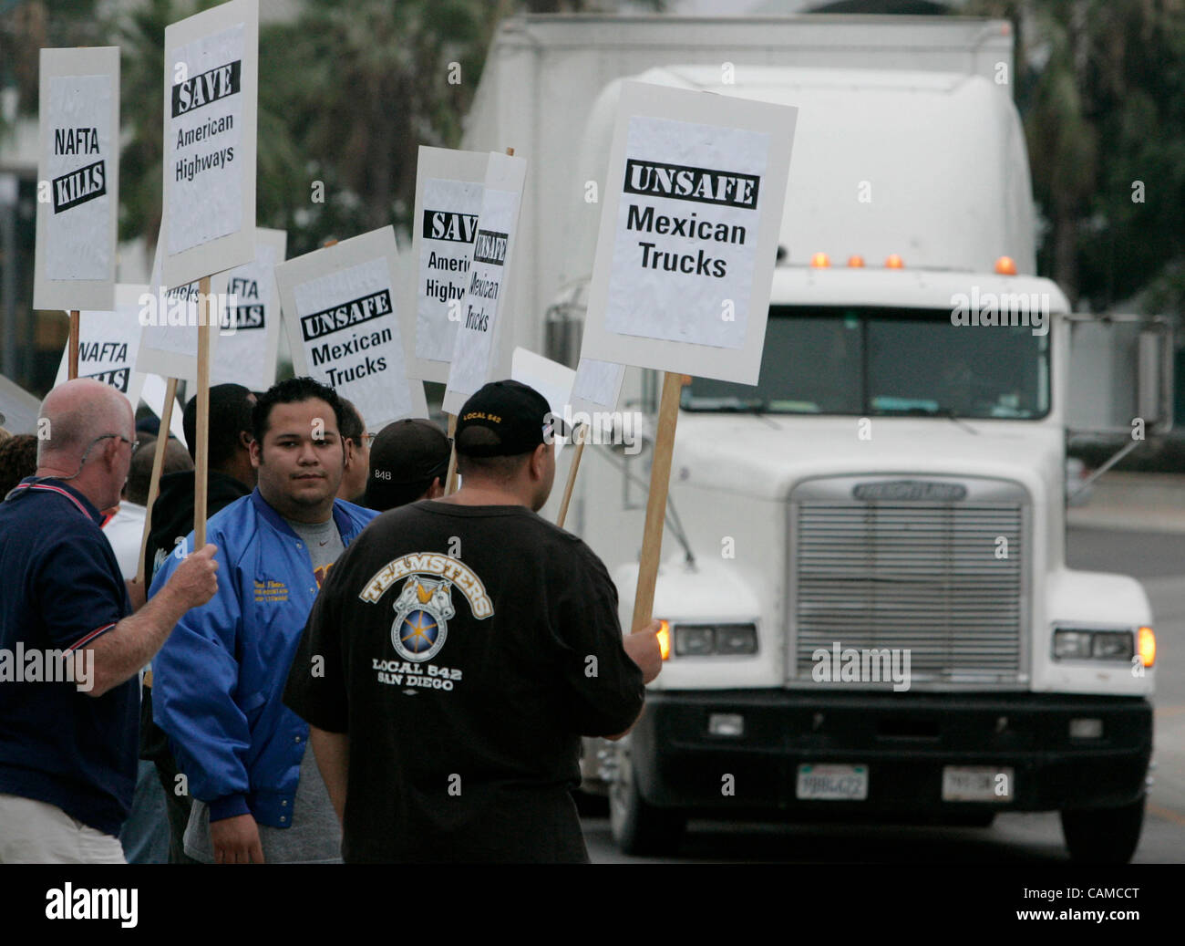 September 6th, 2007, San Diego, California, USA. Teamsters (from left) RICHARD DANA, ELIAS LOPEZ and ROBERTO JIMENEZ picket outside the Otay Mesa Scales and Inspection Facility along Enrico Ferme Drive on Thursday morning in San Diego, California. Truckers were protesting against at NAFTA pilot Mexi Stock Photo