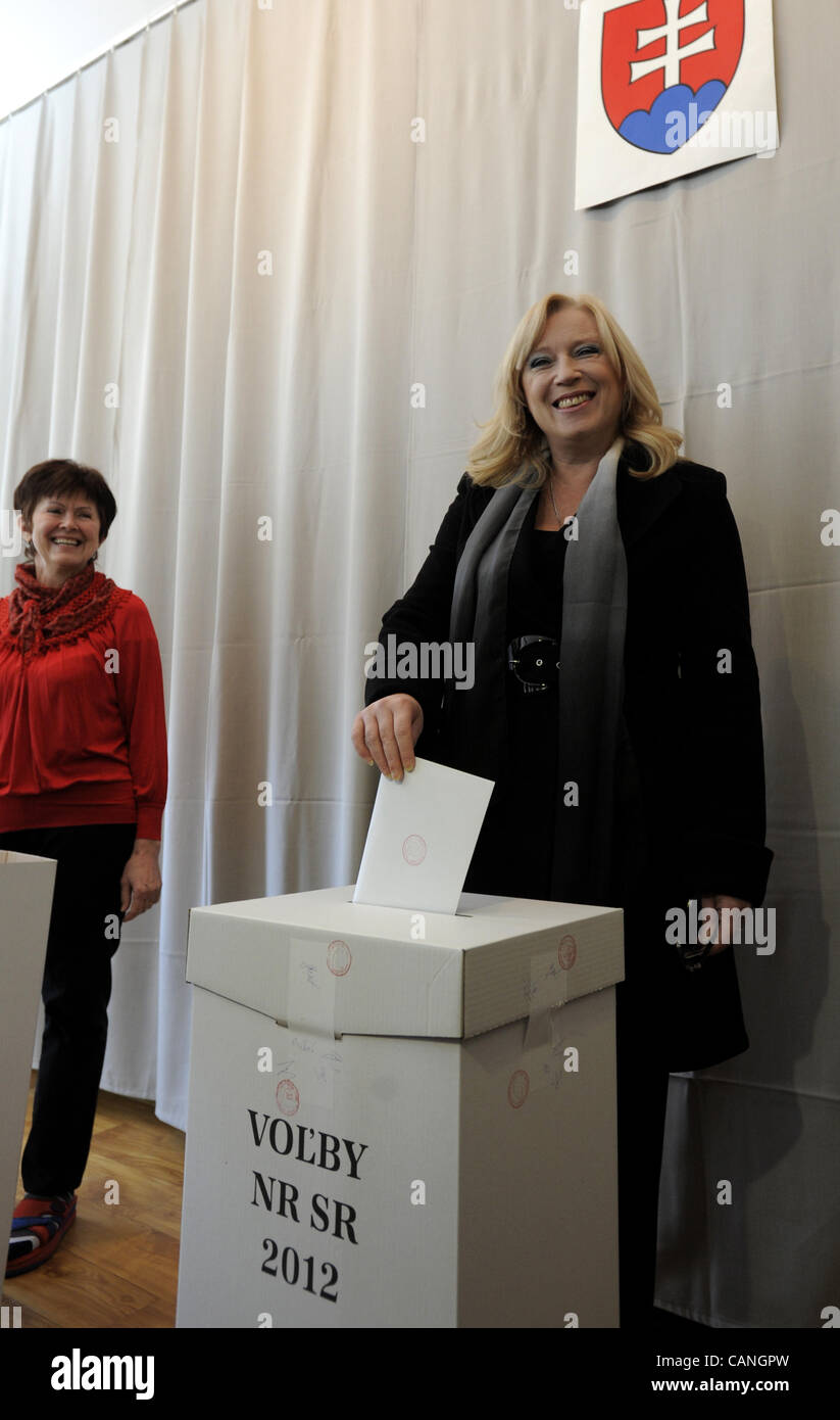Former Slovak Prime Minister Iveta Radicova casts her ballot at a