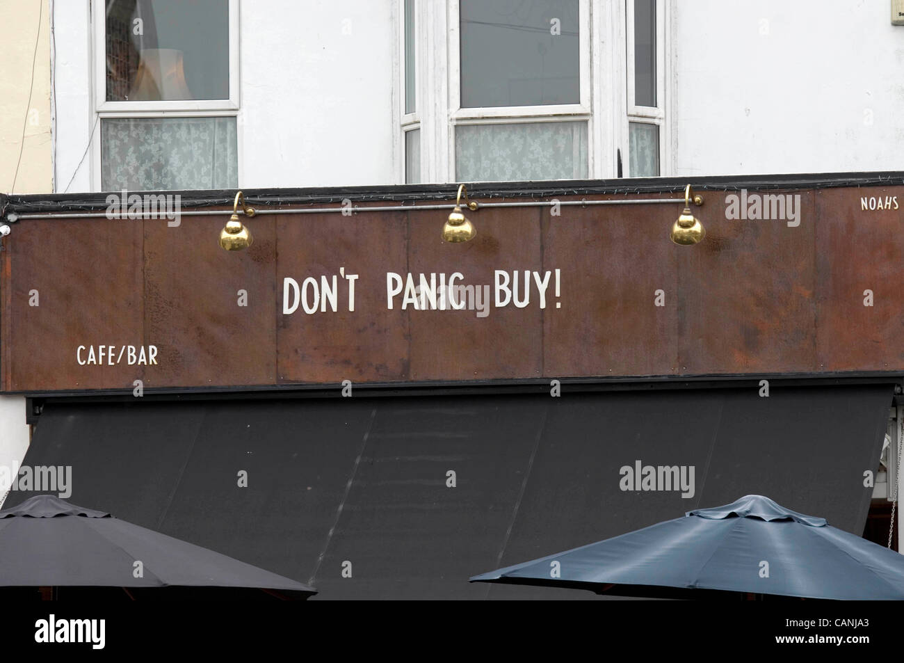 Swansea, UK. 31 Mar, 2012. Sign above Noah's Yard bar in the Uplands district of Swansea saying 'Don't Panic Buy' in reference to the fuel crisis. Stock Photo