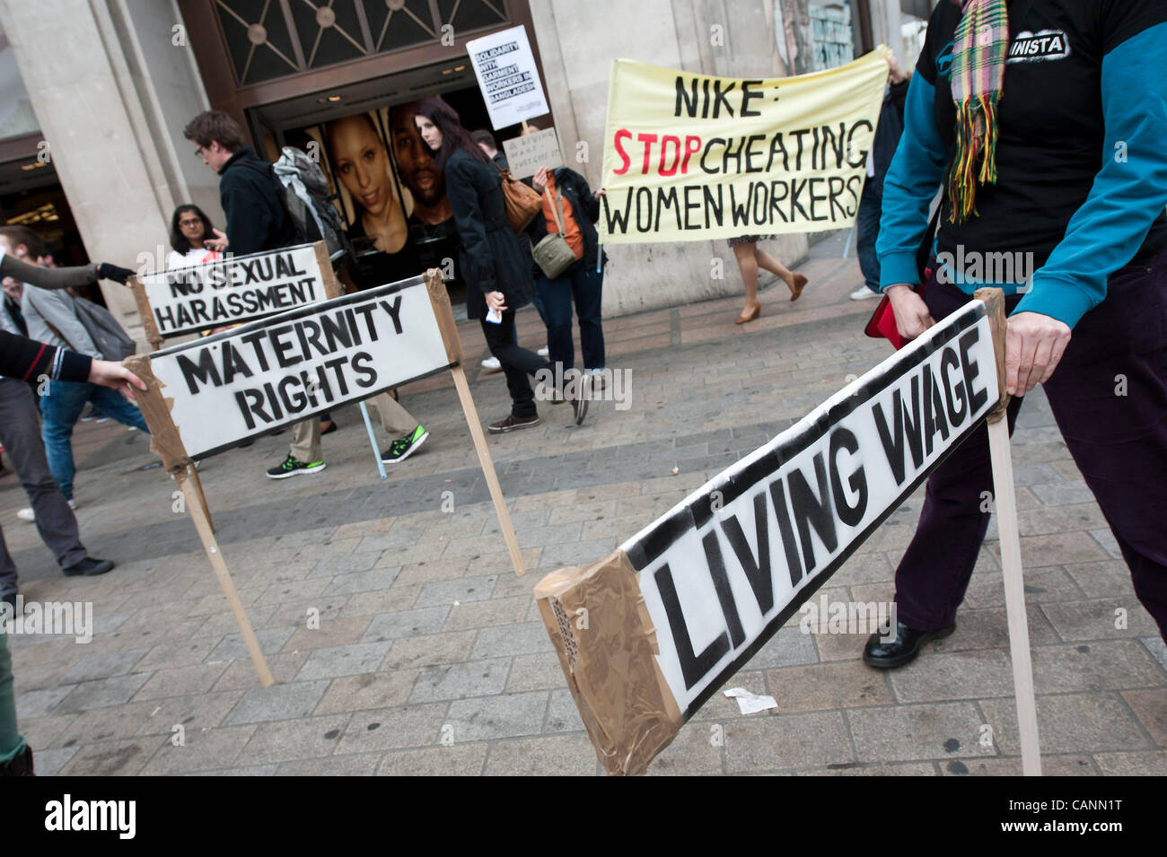 Activists from UK Feminista protest against the exploitation of women  making garments for Olympics sportswear company Nike. Campaigners 'cheat'  their way through a series of races and hold a medal ceremony awarding