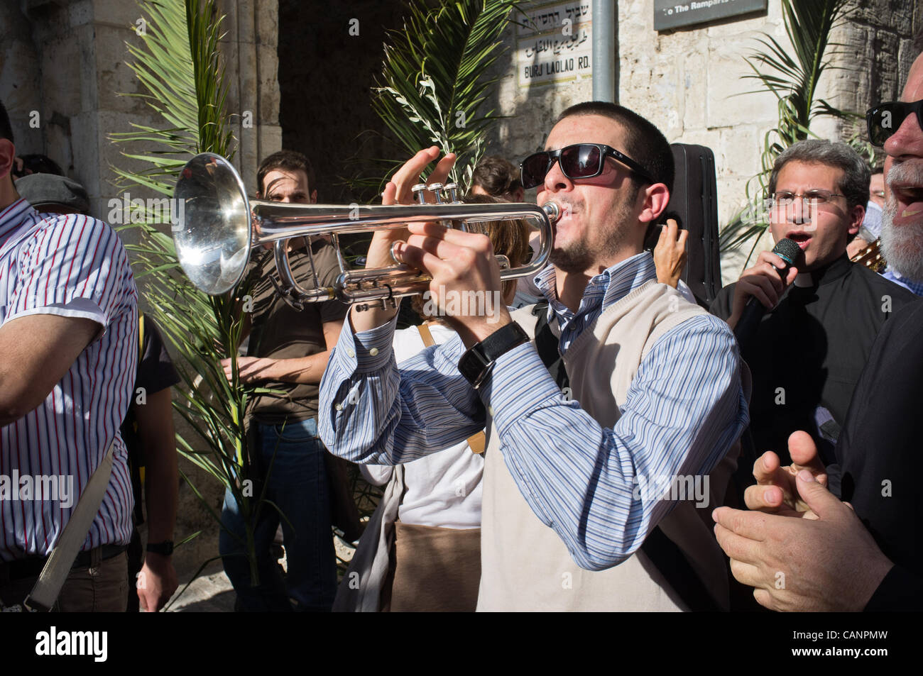 Thousands take part in Palm Sunday procession entering the Old City