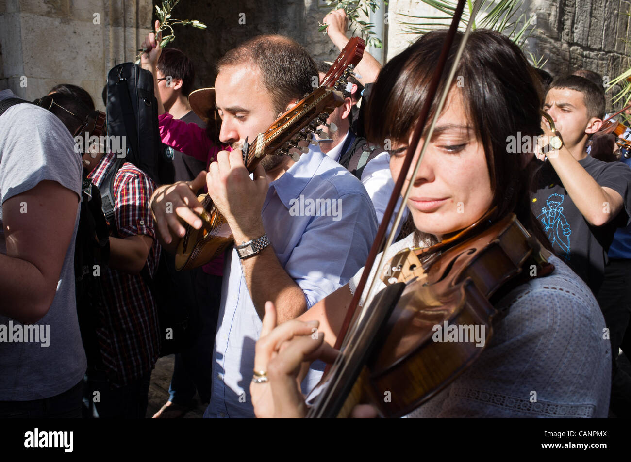 Thousands take part in Palm Sunday procession entering the Old City