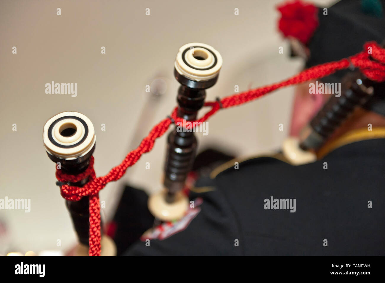 Bagpiper paying bagpipes, in Nassau County Firefighters Pipes and Drums