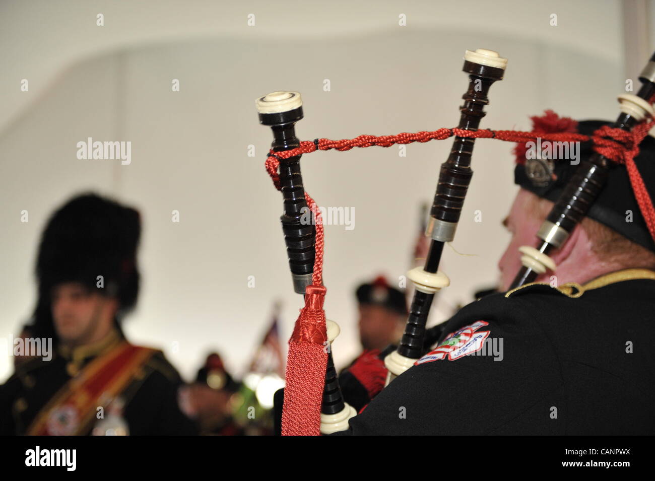 Bagpiper paying bagpipes, in Nassau County Firefighters Pipes and Drums, at fund raiser for