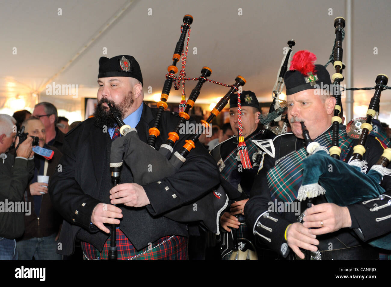 Bagpipers paying bagpipes, in Boston Gaelic Fire Brigade Pipes and Drums, at fund raiser for firefighter Ray Pfeifer - battling cancer after months of recovery efforts at Ground Zero after 9/11 attack - on March 31, 2012, at East Meadow Firefighters Benevolent Hall, New York, USA. Stock Photo