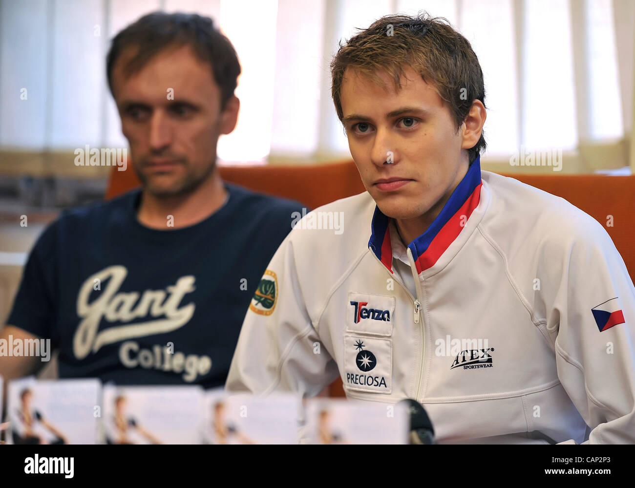 Czech figure skater Michal Brezina (right) and his father Rudolf speak during press conference in Prague, Czech Republic on April 3, 2012 after his arrival from the Ice skating World Cup. (CTK Photo/Igor Sefr) Stock Photo