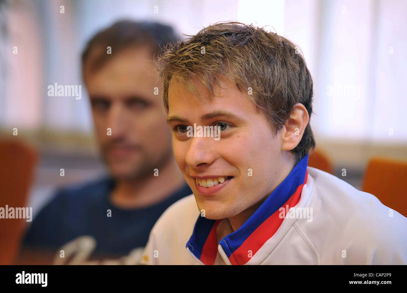 Czech figure skater Michal Brezina (right) and his father Rudolf speak during press conference in Prague, Czech Republic on April 3, 2012 after his arrival from the Ice skating World Cup. (CTK Photo/Igor Sefr) Stock Photo