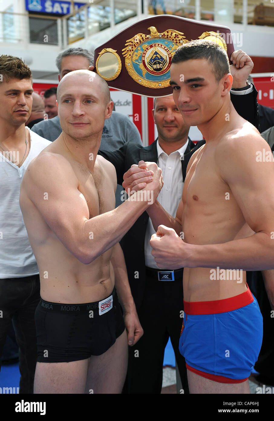 Boxer Lukas Konecny (CZE, left) and Salim Larbi (FRA) pose during the official Weight-In ahead of Interim WBO Light Middleweight Championship Title in Brno Modrice, Czech Republic on April 4, 2012. Konecny's coach Dirk Dzemski stands far left. (CTK Photo/Igor Sefr) Stock Photo