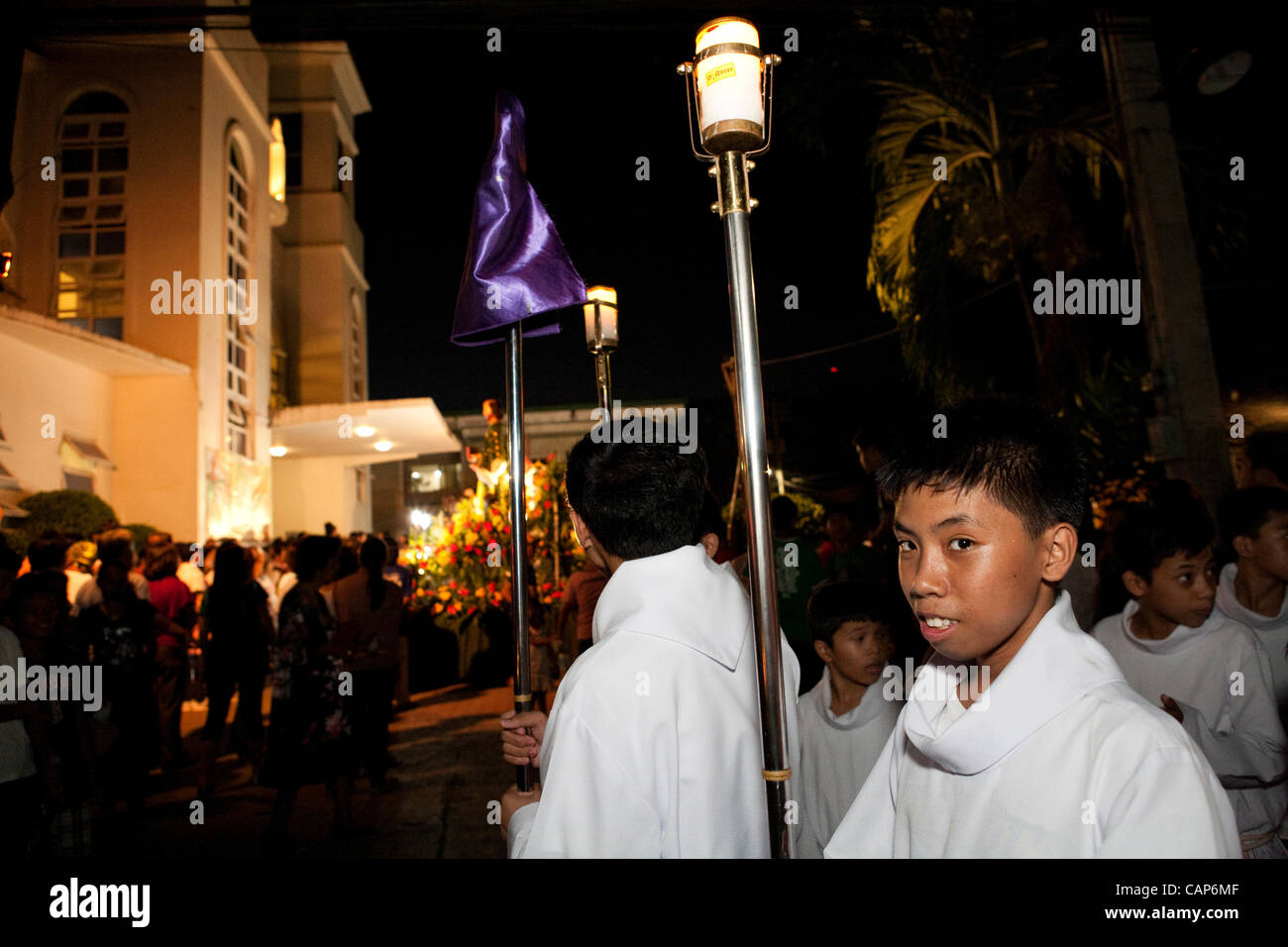 Cebu City, Philippines, 4.April 2012: Traditional Easter ceremonial parade with the Saints.  Preparations for the parade, the sacristans are leading the parade. Stock Photo