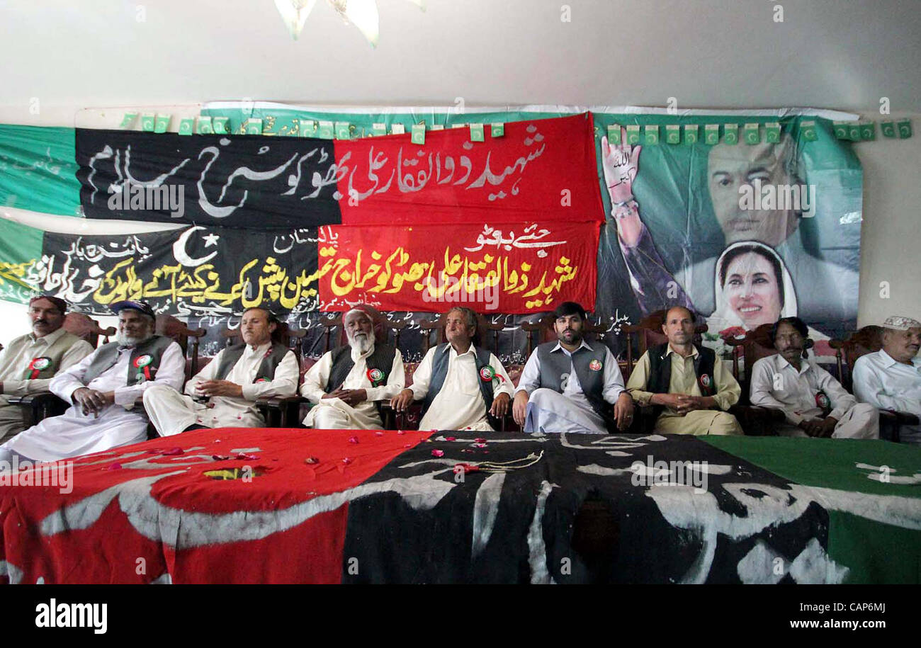 Peoples Party leaders, Saadullah Kakar and Sardar Zain-ul-Abideen Khilji sit on stage during seminar in the connection of Thirty-three Death Anniversary of Peoples Party (PPP) Founder, Zulfiqar Ali Bhutto held in Quetta on Wednesday, April 04, 2012. Stock Photo