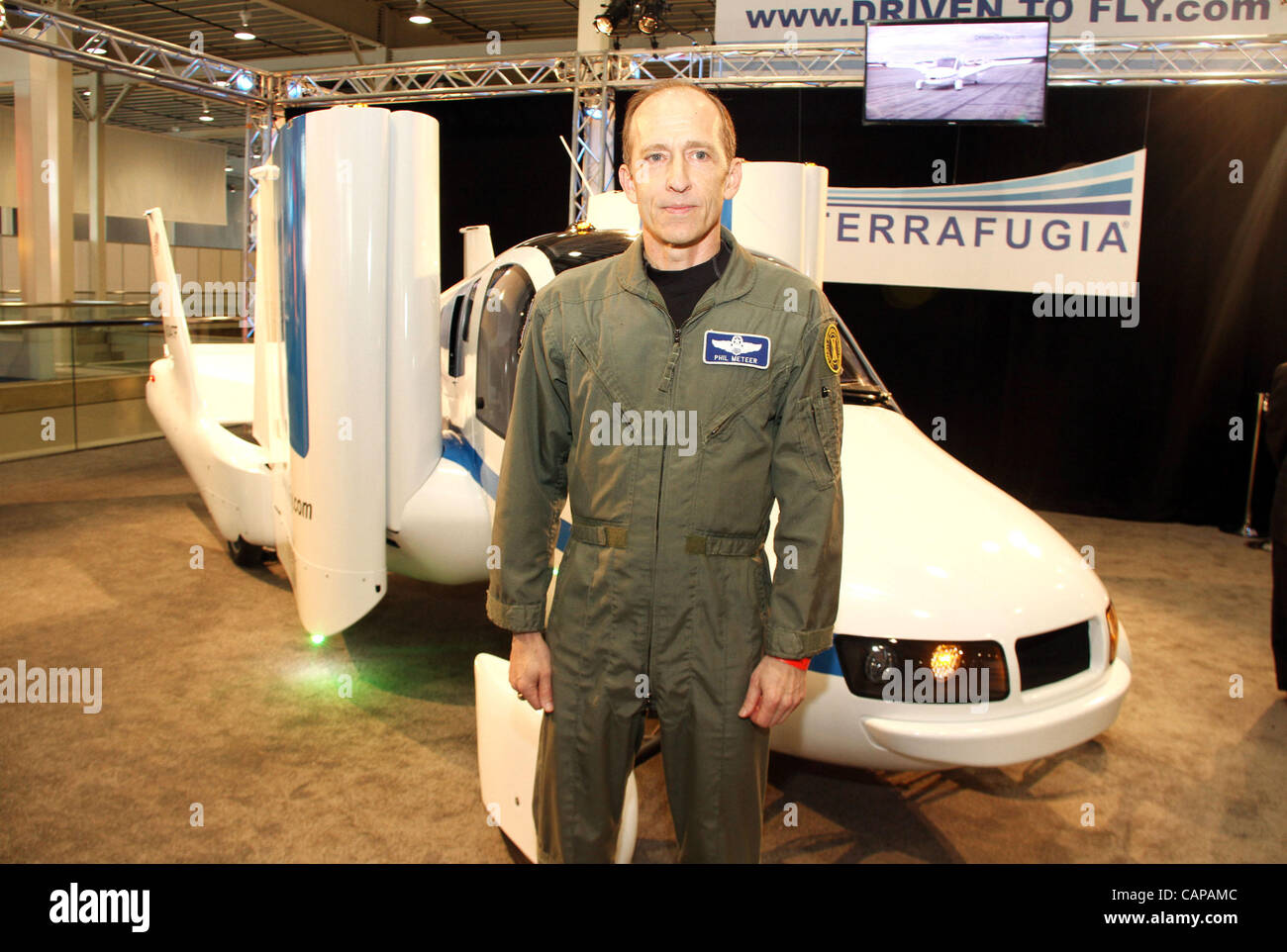 April 4, 2012 - New York, New York, U.S. - Test driver PHIL METEER stands in front of the TERRAFUGIA TRANSITION car-airplane vehicle which is expected to retail for $279,000 on display  during the New York Auto Show at the Jacob Javits Center. (Credit Image: © Nancy Kaszerman/ZUMAPRESS.com) Stock Photo