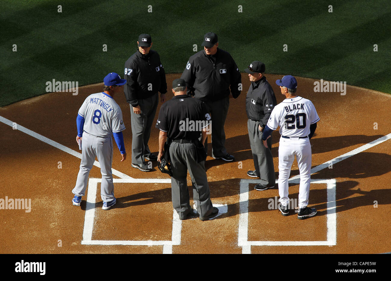 April 5, 2012 - San Diego, CA, USA - April 5, 2012 - San Diego, California, USA -  DON MATTINGLY, manager of the Los Angeles Dodgers, left, and Bud Black, manager of the San Diego Padres meet with umpires prior to a game on opening day of Major League Baseball at Petco Park in San Diego, CA on Thurs Stock Photo