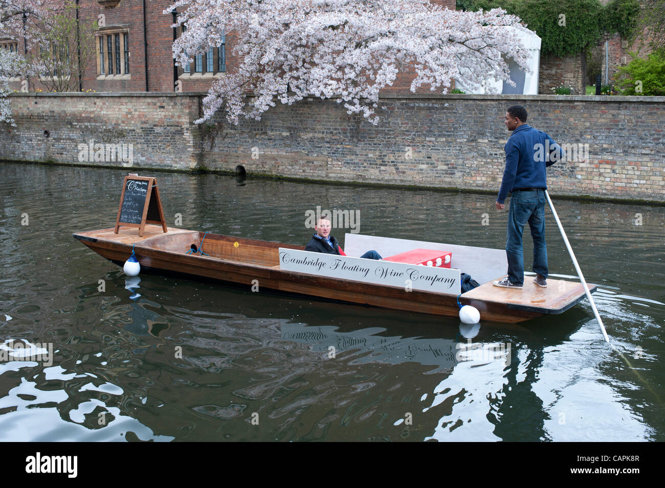 The Cambridge Floating Wine Company punt cruising on the River Cam, Cambridge UK 7/4/12. The punt started trading this weekend selling alcoholic drinks to people on the River. This is the first of its kind at the famous tourist attraction which gets thousands of visitors a year. Stock Photo