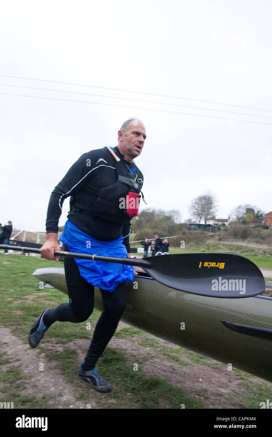 Devizes, UK. 07 April 2012. Sir Steve Redgrave running the first of the 70  portages during the 125 mile Devizes to Westminster race. He started the 125 mile race in Devizes at 09.45 on Easter Saturday and expects to take approx. 22 hours to finish. Stock Photo
