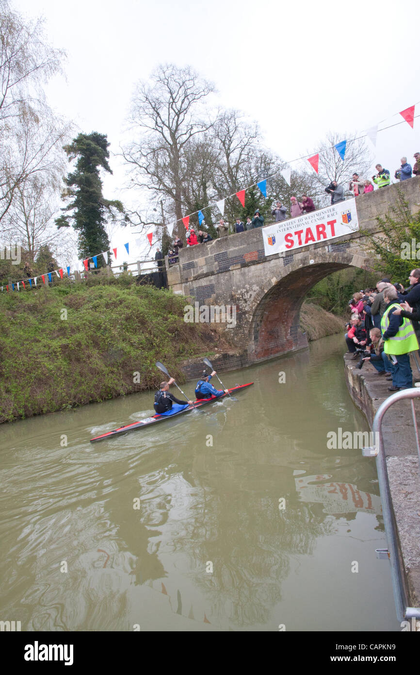 Devizes, UK. 07 April 2012. Sir Steve Redgrave (rear) and Roger Hatfield start the Devizes to Westminster Canoe Race. They started at 09.45 on Easter Saturday and expect to take approx. 22 hours on Kennet and Avon Canal then the River Thames to finish at Westminster around 8.00am Easter Sunday. Stock Photo