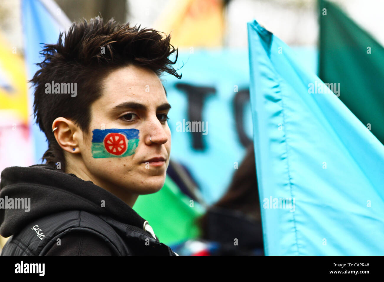 London, UK. 08/04/2012. A protester with the Roma flag painted on her face. 8th April marks Roma Nation Day. Stock Photo
