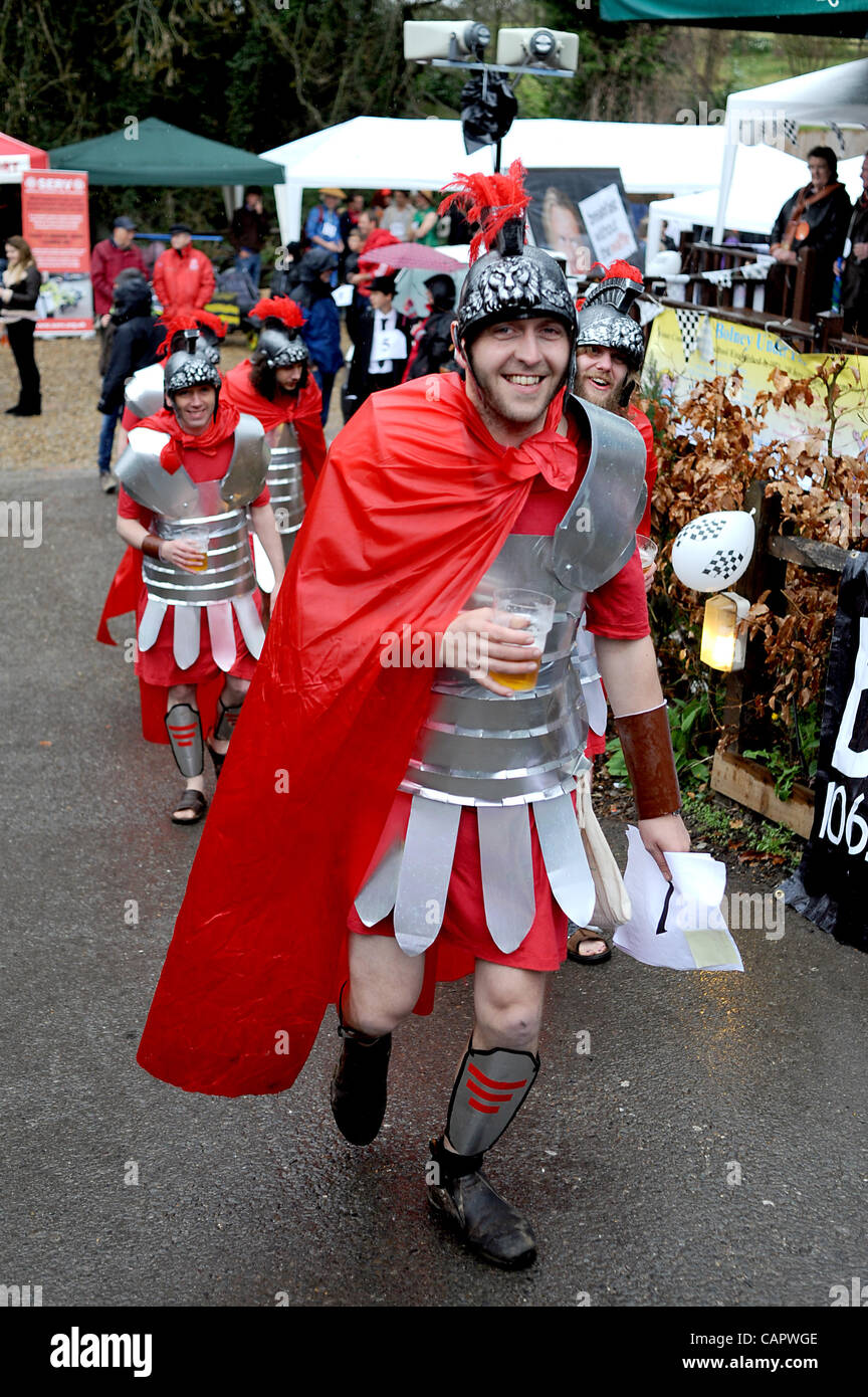 Centurians enjoy a beer despite the wind and rain before taking part in the Bolney Pram Races through the Sussex village UK Stock Photo