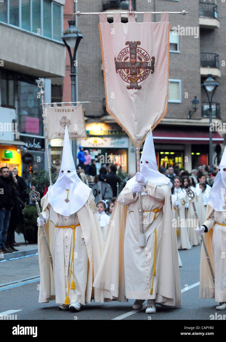 Semana Santa 2012: Traditional processions of Easter in the spanish city of Valladolid Penitents of the Cofradia de la Ultima Cena (Last Dinner) with their pendon Stock Photo