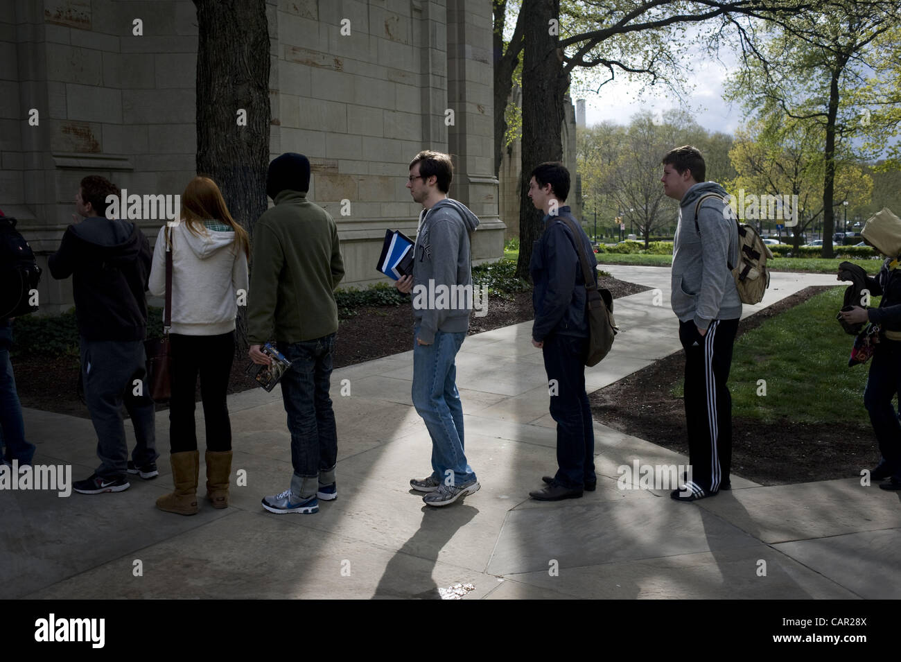 April 10, 2012 - Students queue in a security line outside the Cathedral of Learning at the University of Pittsburgh early Tuesday morning, April 10, 2012. 57 bomb threats have been received on campus since mid-February, causing increased security. Stock Photo