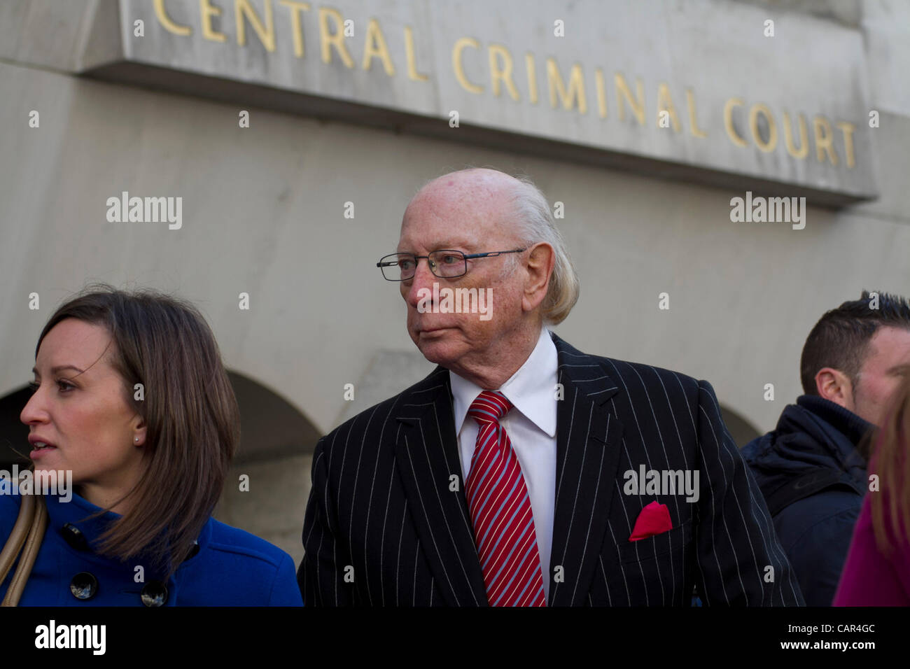 London, UK, Wednesday 11th April 2012.  (Pictured) Maurice Reeves (C) owner of  'House of Reeves' Furniture Store pictured outside Central Criminal Court, Old Bailey, London. Gordon Thompson (not pictured) was sentenced today for burglary and arson which destroyed 'House of Reeves' during the riots on Aug 8th 2011 Stock Photo