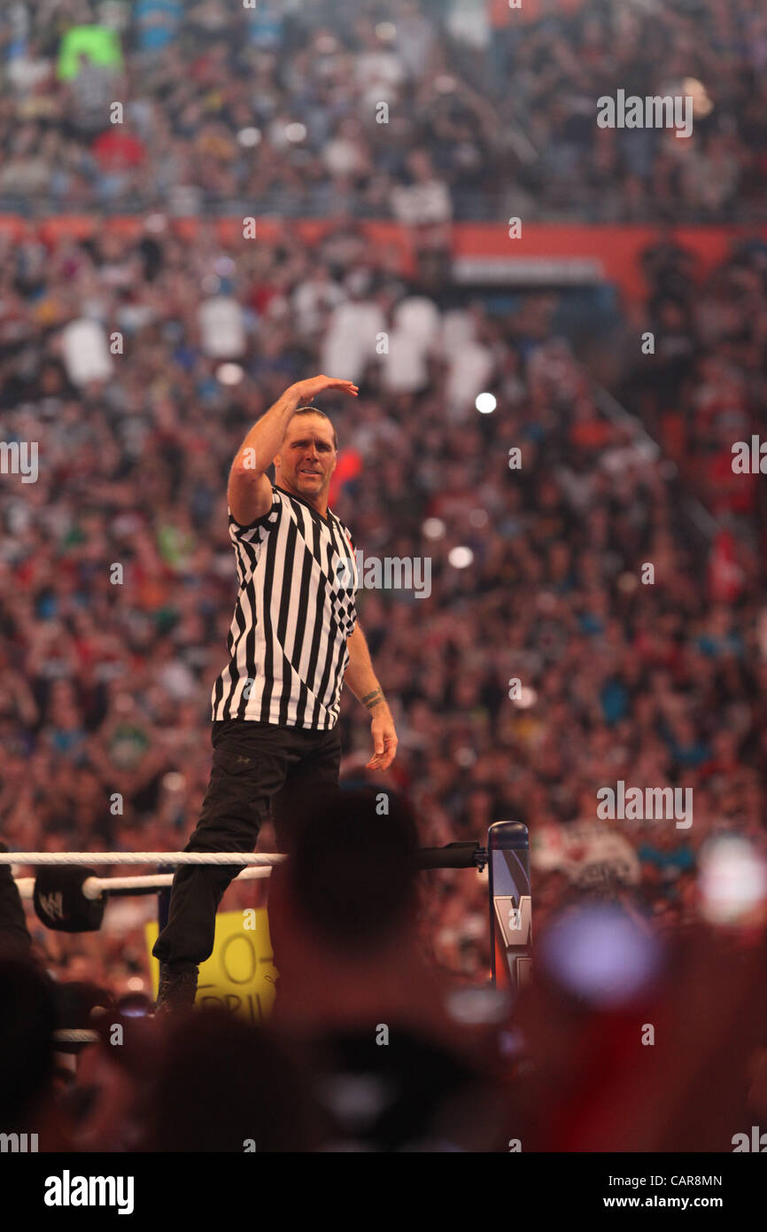 WWE legends The Undertaker wrestled Triple H at Wrestlemania 28 in Miami, FL at Sun Life Stadium. WWE Hall of Famer Shawn Michaels served as the special referee. The Undertaker won, advancing his streak to 20-0 at Wrestlemania events. Stock Photo