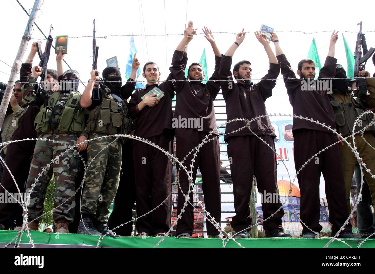 April 13, 2012 - Gaza, Gaza Strip, Palestinian Territory - Hamas supporters acting as freed prisoners take part in a rally, calling for the release of Palestinian prisoners from Israeli jails, in Jabalya, in the northern Gaza Strip, April 13, 2012. Photo by Mohammed Asad  Stock Photo