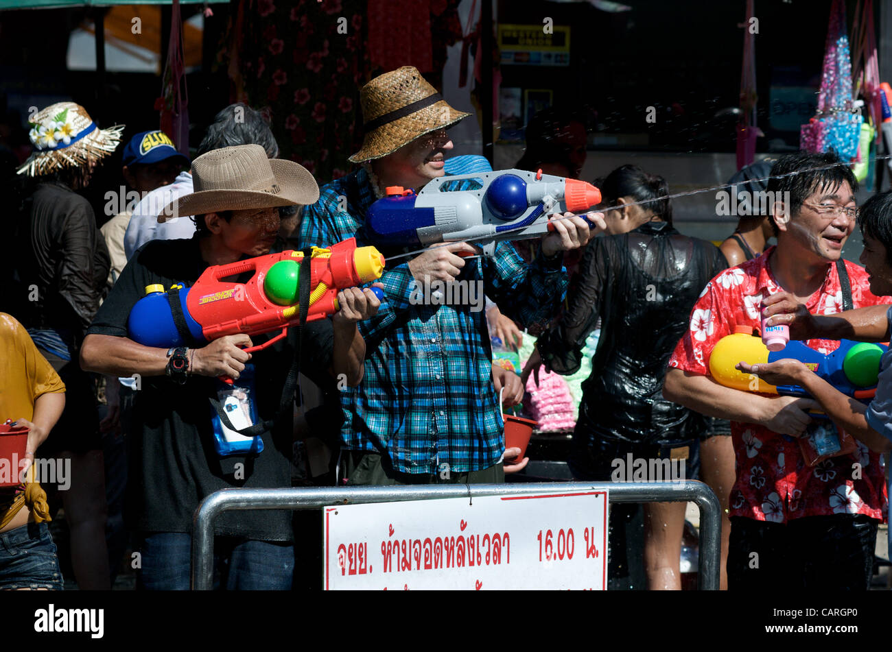 People celebrating the water festival on Sukhumvit Road, Bangkok, Thailand on Saturday, April 14th, 2012. Bangkok is celebrating the Thai New Year with the traditional Songkran water festival. Stock Photo