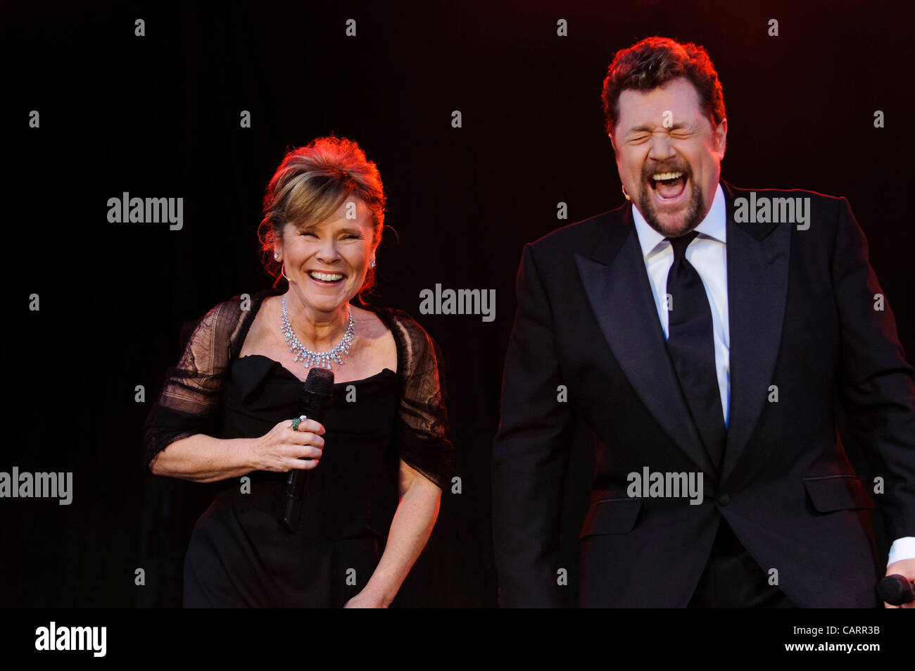 LONDON, Covent Garden, 15 April 2012.  At the Olivier Awards 2012, (left) Imelda Staunton (actress) and (right) Michael Ball (singer and actor) prepare to introduce the announcers of the BBC Radio 2 Olivier Audience Award. Photograph : Stephen Chung Stock Photo