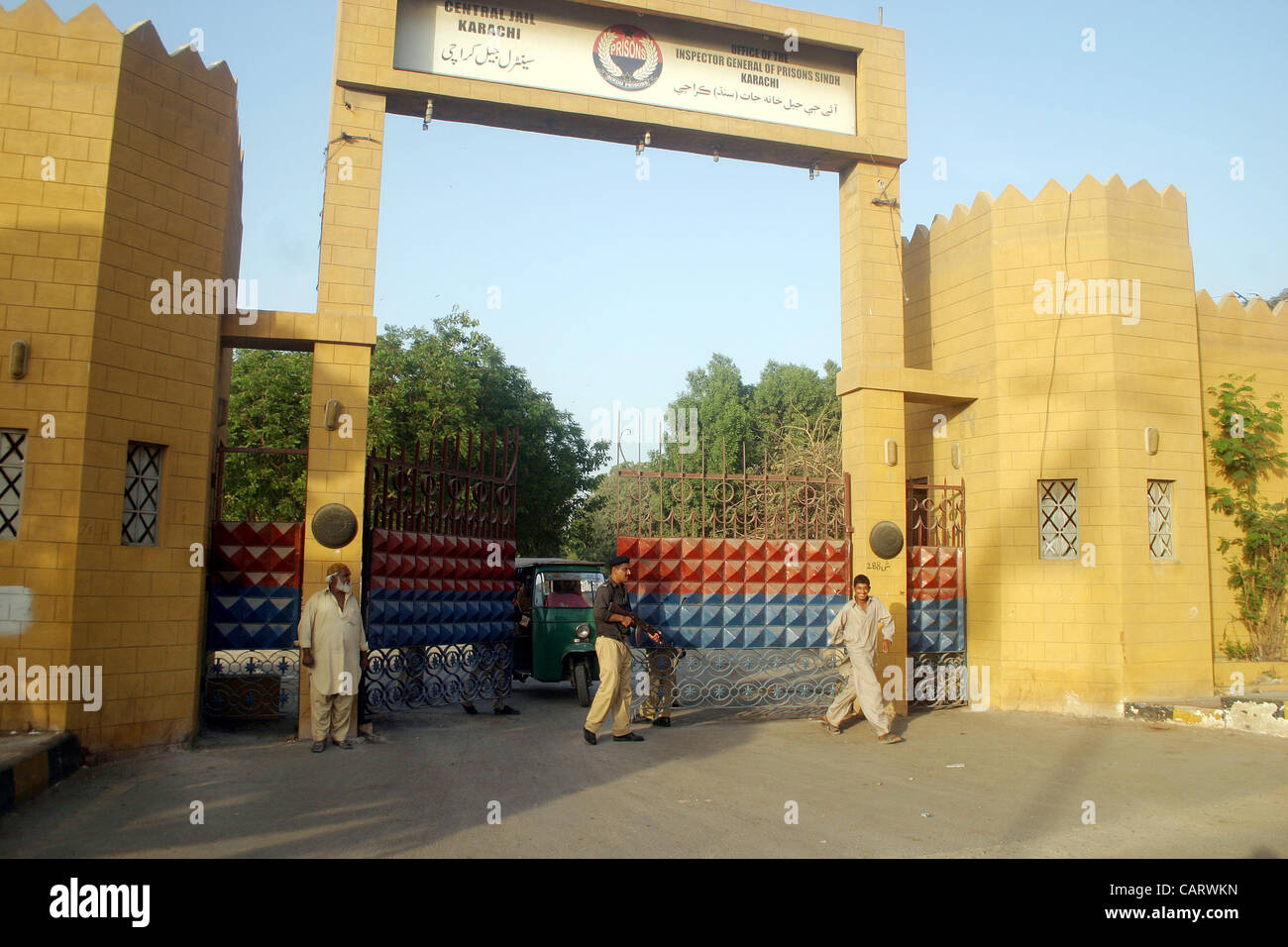 A policeman stands guard at central prison as four prisons in Sindh province including Karachi Central prison, Landhi prison, Hyderabad prison and Sukkur prison are declared sensitive on Monday after militants attack at Bannu prison, in Karachi on Monday, April 16, 2012. Stock Photo