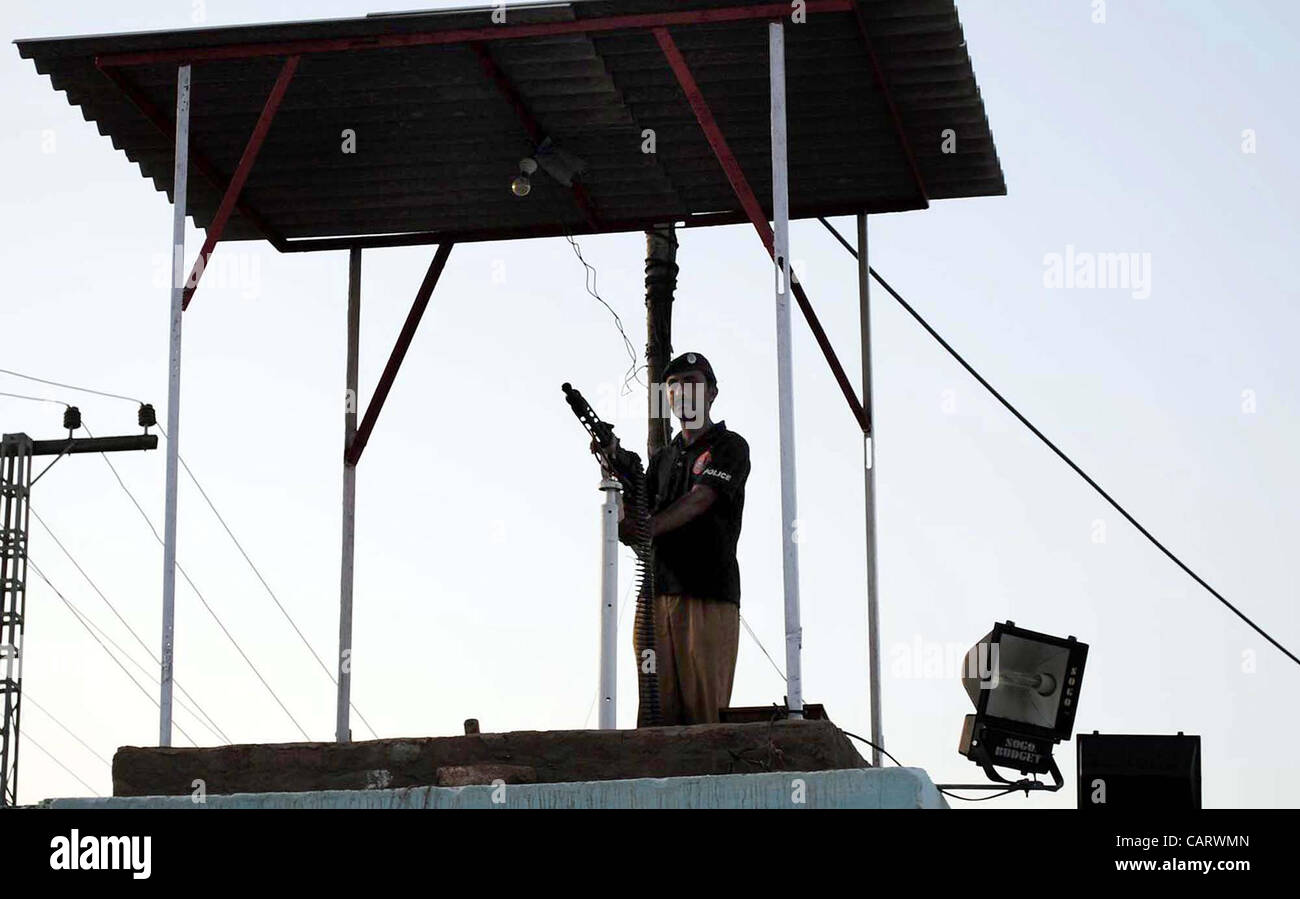 A policeman stands guard at central prison as four prisons in Sindh province including Hyderabad central prison, Karachi central prison, Landhi prison and Sukkur prison are declared sensitive on Monday after militants attack at Bannu prison, in Hyderabad on Monday, April Stock Photo