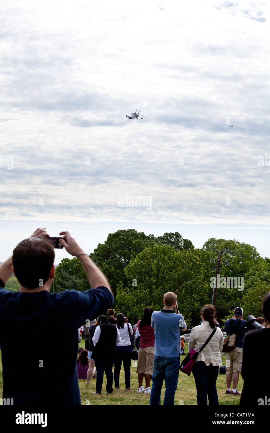 April 17, 2012 - Washington, DC, U.S. - Space shuttle Discovery, mounted on the Shuttle Carrier Aircraft, has flown over the Washington, D.C. area. Onlookers are watching the final flight and taking pictures. (Credit Image: © Dasha Rosato) Stock Photo