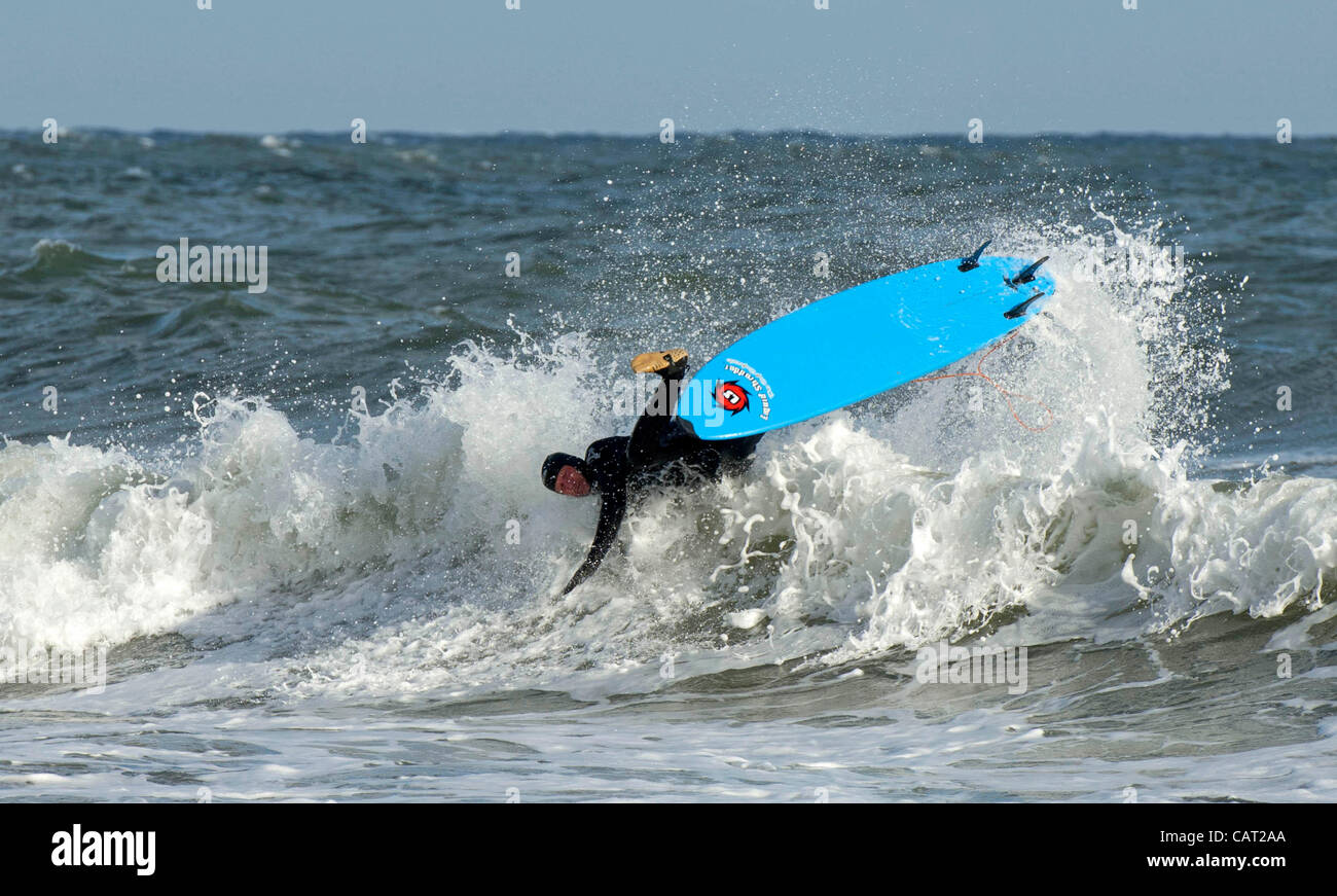 Surfer making the most of the storm surf at Langland Bay near Swansea